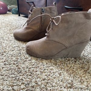 Tan wedge booties.